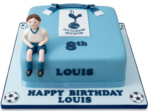 Light blue square football cake with Tottenham Hotspur kit, fondant boy, and custom age topper.