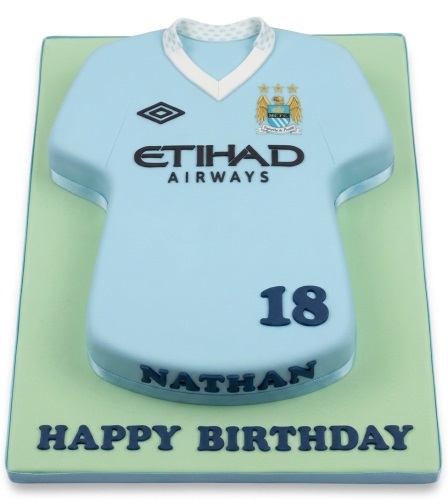 Light blue Manchester City football shirt cake with custom name and age.