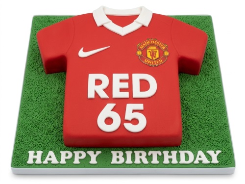 Red Manchester United football shirt cake with club crest and customisable name and age on a green grass board.