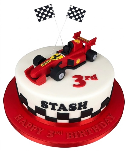 Round white cake with red Formula 1 car, checkered flags, and racing checkerboard pattern.
