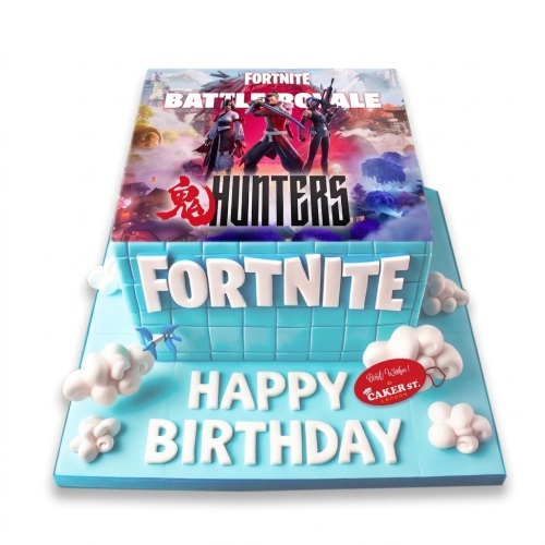 Rectangular blue Fortnite Battle Royale birthday cake with game image, logo, and white clouds.