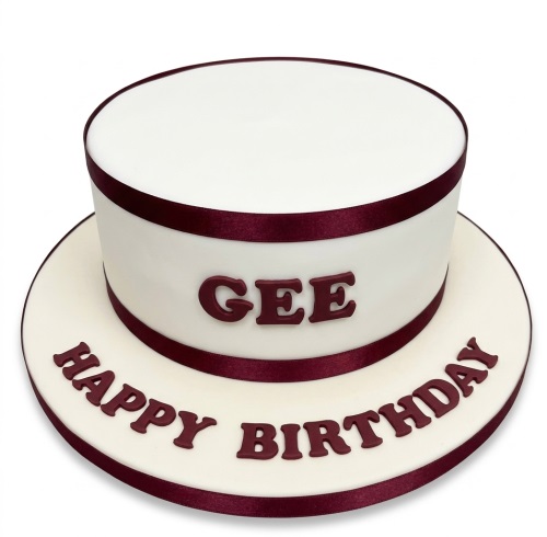 Round personalised birthday cake with white icing, burgundy ribbons, and custom message.
