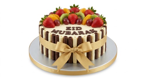Round Eid Mubarak cake with fresh fruits, chocolate rolls, and gold ribbon.