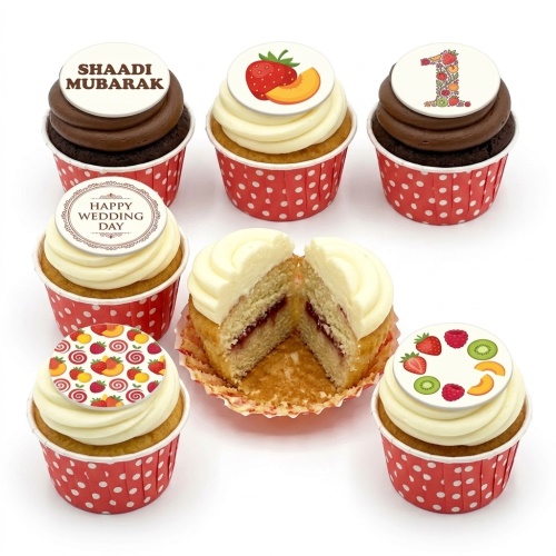 Assortment of fruit theme cupcakes with edible toppers, including custom age '1' and celebration messages.