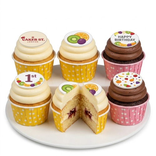 Cupcakes with white and chocolate frosting, decorated with edible fruit toppers and example birthday messages.