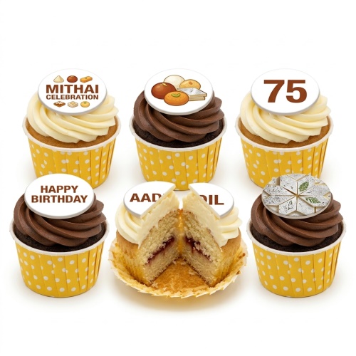 Set of Mithai Celebration Birthday Cupcakes with white and chocolate frosting, yellow polka dot cases, and edible toppers including Indian sweets, 'Happy Birthday', '75', and 'AADIL'.