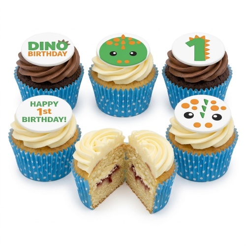 Dinosaur themed 1st birthday cupcakes with green and orange toppers and a number one.