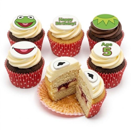 Kermit the Frog themed cupcakes with green and white icing, some with 'Happy Birthday' and 'Age' toppers.
