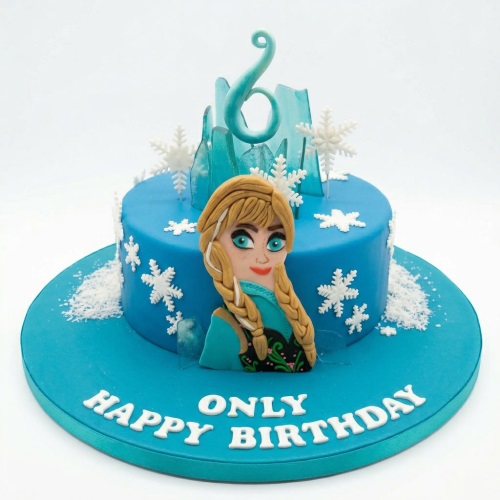 Blue Frozen theme birthday cake with edible Anna character, ice shards, snowflakes, and custom age topper.