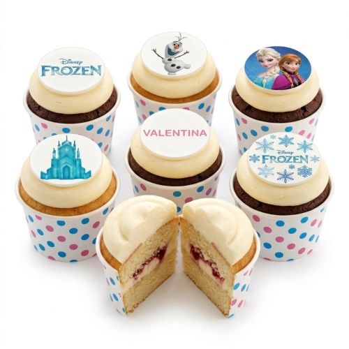 Disney Frozen themed cupcakes with Elsa, Anna, Olaf, castle, and snowflake edible toppers in polka dot wrappers.