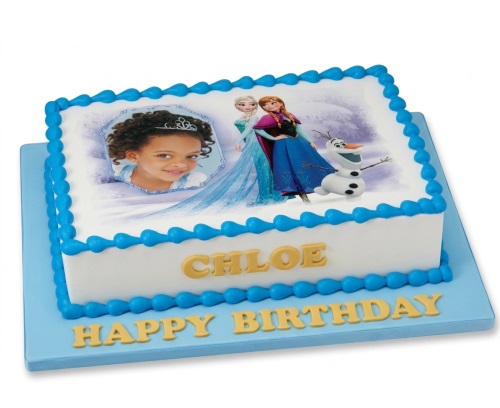 Rectangular white cake with blue icing, featuring Disney Frozen characters Elsa, Anna, Olaf, and a child's photo.