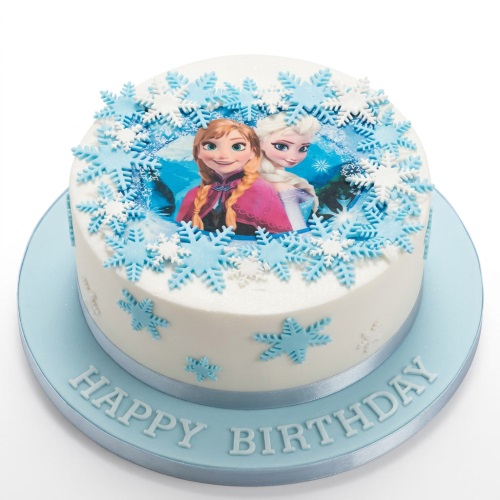 Round white Frozen birthday cake with Anna and Elsa edible image and blue snowflakes.