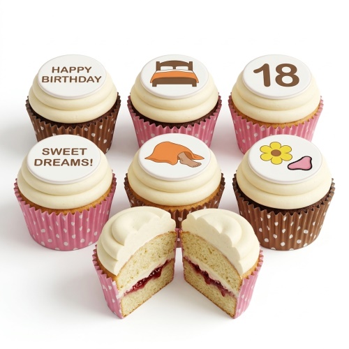 Cupcakes with white frosting, bed, foot, flower, 'Happy Birthday', 'Sweet Dreams!' toppers. One cupcake cut open.