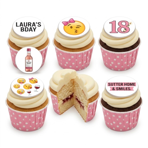 A selection of adult birthday cupcakes with white icing and pink polka dot wrappers, featuring edible toppers with emojis, wine bottles, wine glasses, and a custom age '18'.