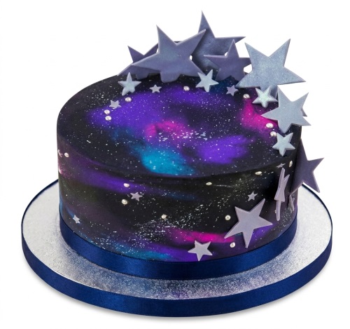 Round galaxy themed birthday cake with purple, blue, pink colours and silver stars.
