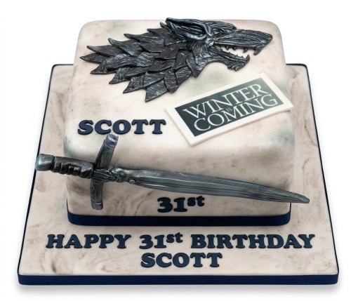 Square Game of Thrones themed birthday cake with direwolf, sword, and custom age and name.