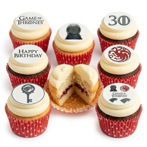 Game of Thrones themed cupcakes with Iron Throne, House Targaryen, House Stark sigil, and custom age/message toppers.