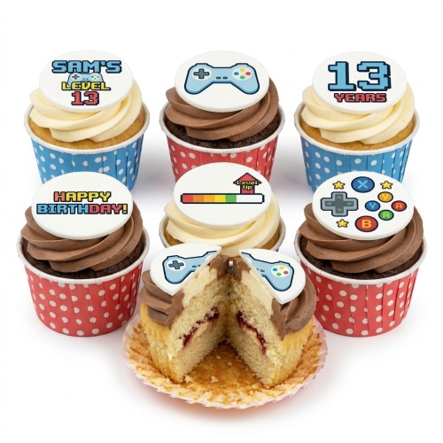 Vanilla and chocolate cupcakes with white toppers featuring gaming controllers and pixelated 'level up' designs.