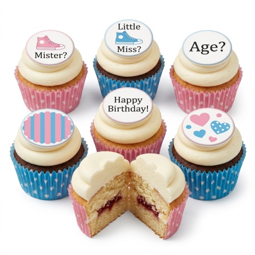 Pink and blue gender reveal cupcakes with baby shoes, stripes, hearts, and birthday toppers.