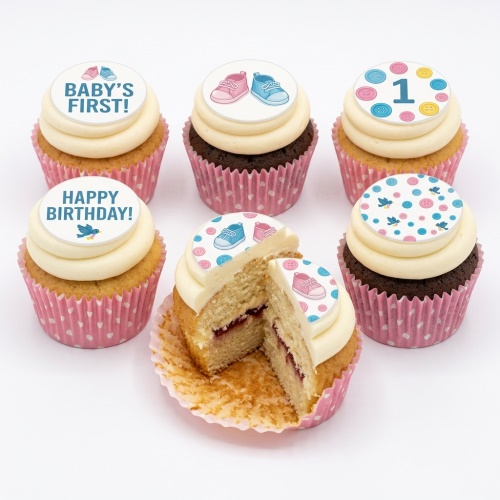 Vanilla and chocolate cupcakes with baby shoes, buttons, and 'Baby's First!' edible toppers.