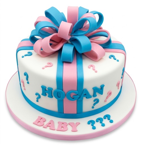 White round cake with pink and blue ribbons, a large bow, and question marks for a gender reveal.