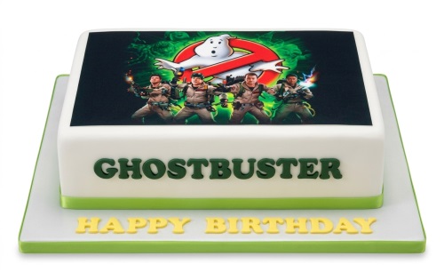 Square white Ghostbusters birthday cake with logo and characters.