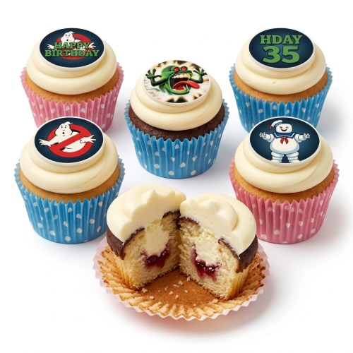 Ghostbusters themed cupcakes with Slimer, Stay Puft, and logo toppers, white frosting, and colourful cases.