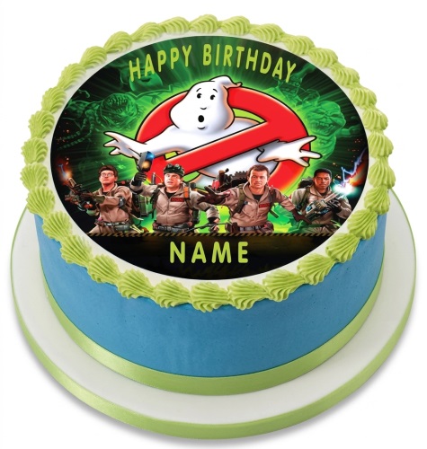 Round Ghostbusters birthday cake with blue icing, green piping, and an edible image of the Ghostbusters team and logo.