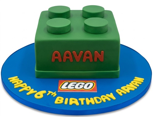 Green LEGO brick birthday cake on a blue board with custom name and message.