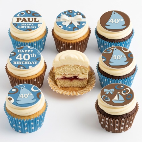 Collection of nautical themed birthday cupcakes with sailing boats, bows, and abstract blue and brown patterns, some with custom age and name examples.
