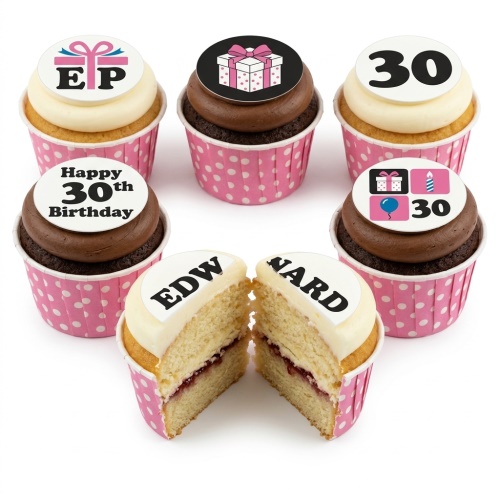 Assortment of personalised birthday cupcakes with gift box, balloon, candle, and custom age toppers.