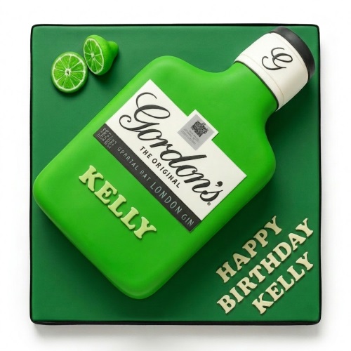 3D Gordon's Gin bottle birthday cake on a green board with lime slices.