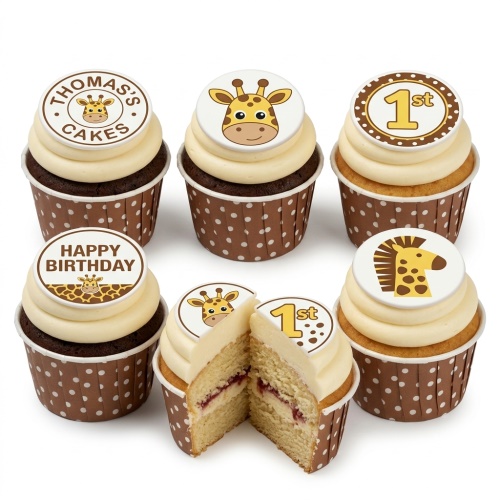 Giraffe themed birthday cupcakes with white icing, brown polka dot cases, and edible toppers including giraffe faces and '1st' age.