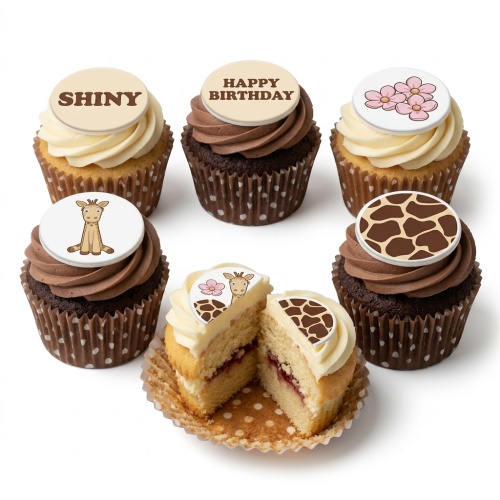 Jungle theme birthday cupcakes with giraffe and safari print toppers, and pink flowers.