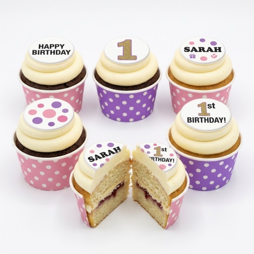 Pink and purple polka dot birthday cupcakes with custom age and name toppers.
