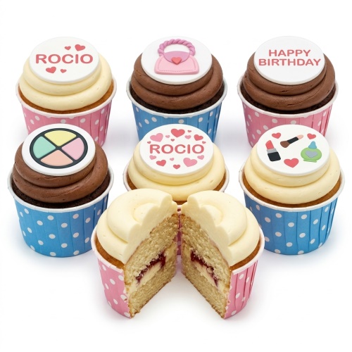 Cupcakes with pink handbag, makeup palette, lipstick, and 'Happy Birthday' toppers, in pink and blue cases.