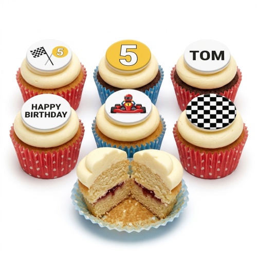 A selection of go kart and racing themed birthday cupcakes with cream frosting and edible toppers including a custom age '5', a go-kart, and a chequered flag.