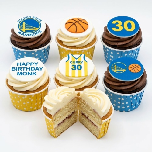 Assortment of basketball themed cupcakes with team logo and custom age topper.