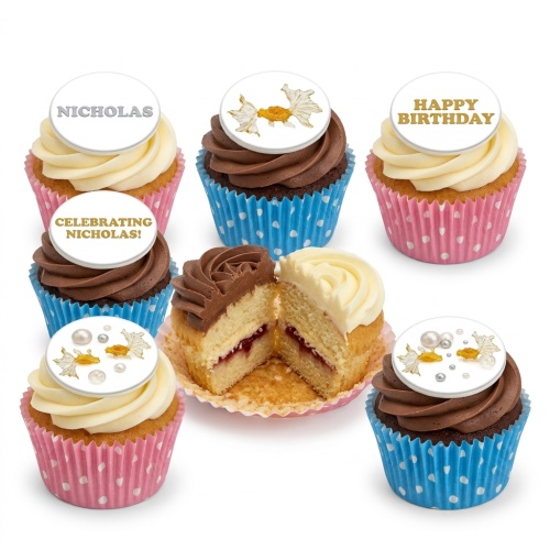 Assorted goldfish theme birthday cupcakes with personalised and decorative toppers, in pink and blue cases.