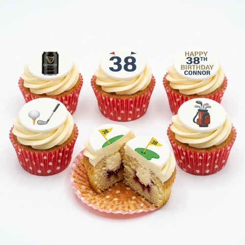 Cupcakes with white frosting, red polka dot wrappers, featuring golf club, ball, bag, Guinness can, and custom age toppers.
