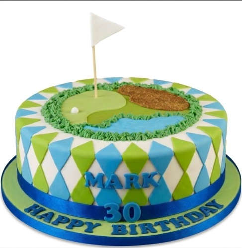 Round single-tier golf course birthday cake with green, water, sand trap, golf ball, flag, and blue and green argyle pattern on the side.