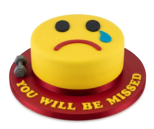 Yellow sad emoji cake with a grey dumbbell and 'You Will Be Missed' message on a red cake board.