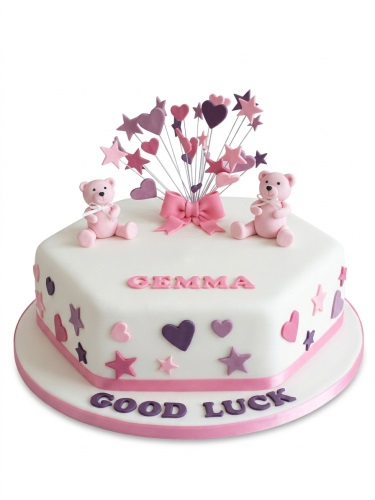 White hexagonal cake with pink teddy bears, pink and purple hearts, and stars on top and sides.
