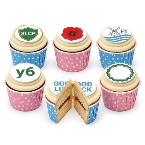 A selection of cupcakes with white frosting and custom edible toppers, including a "Good Luck" message.