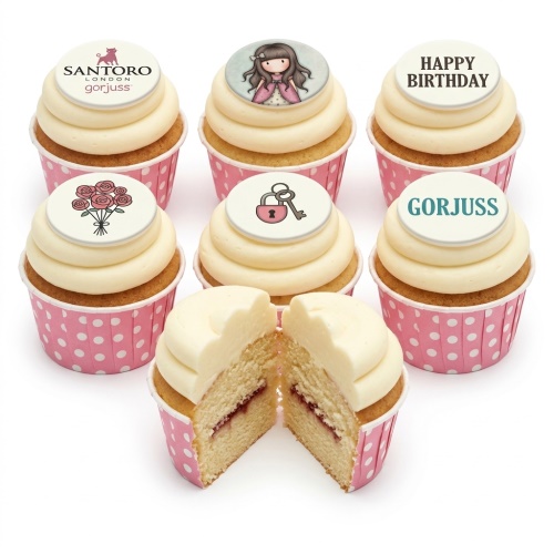 Six Gorjuss themed birthday cupcakes with white frosting and pink polka dot wrappers, featuring character, rose, lock and key, and "Happy Birthday" toppers.