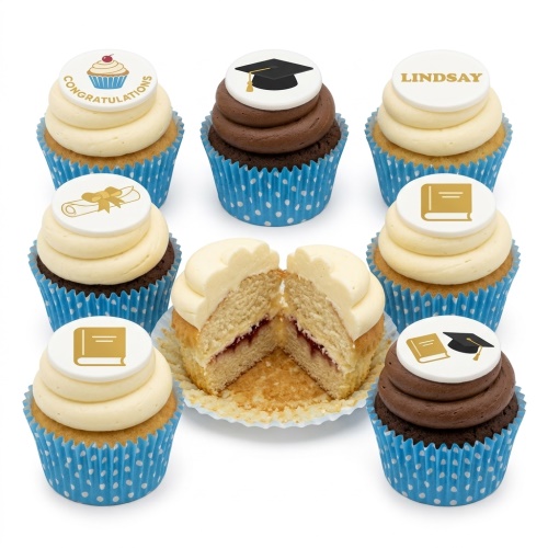 Assortment of graduation cupcakes with edible toppers including a cap, diploma, book, and 'Congratulations' message.