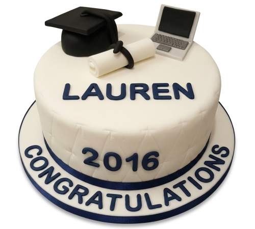 White graduation cake with black mortarboard, diploma scroll, and laptop, featuring a navy blue 'Congratulations' message and custom year.