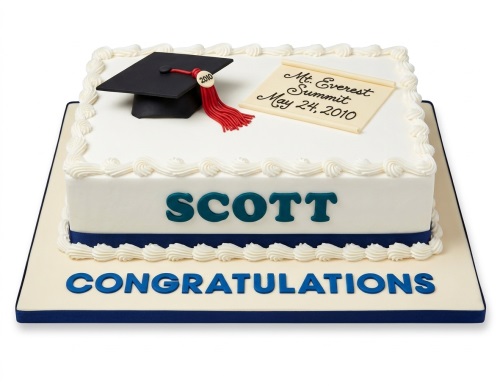 White rectangular graduation cake with black cap, red tassel, custom scroll, and blue text.