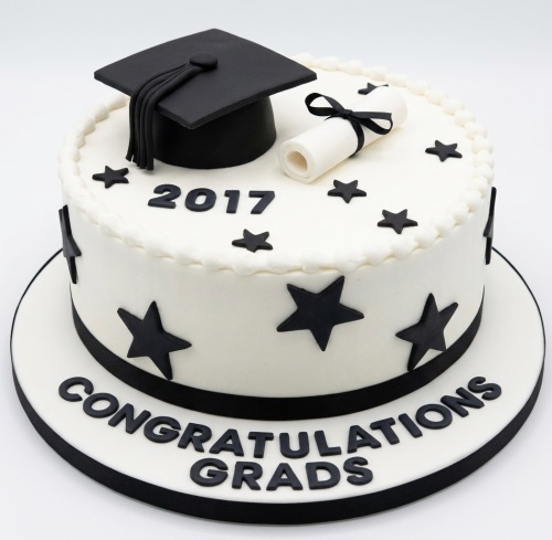 White graduation cake with black cap, diploma scroll, stars, and customisable year.