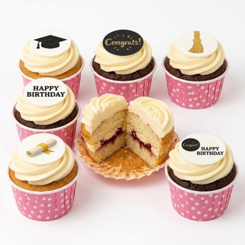 Cupcakes with graduation cap, scroll, tassel, 'Congrats!' and 'Happy Birthday' toppers in pink polka dot cases.